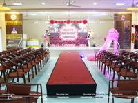 Fashion show ramp with stage decor and high heels shoe made of balloons to complete the party scene. 